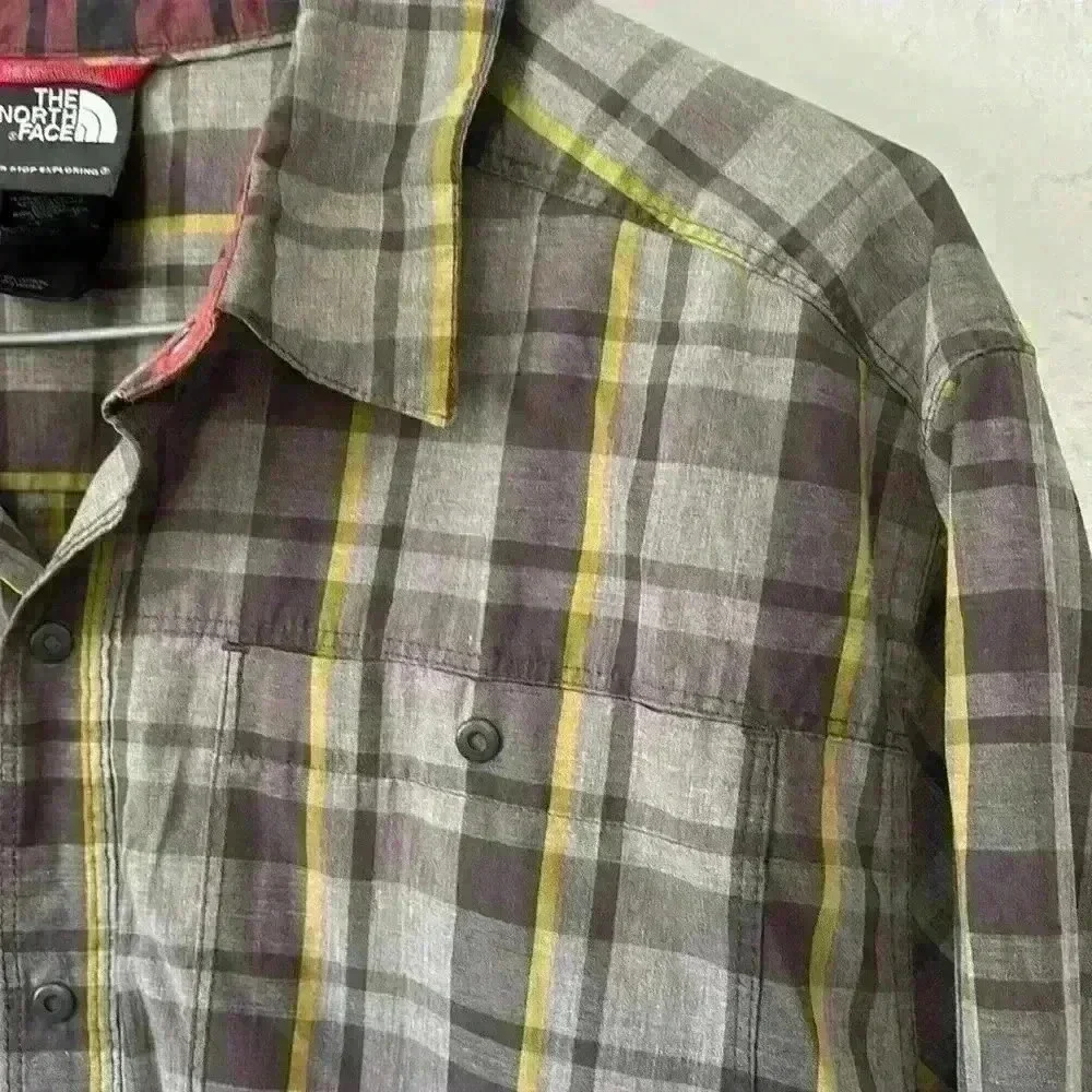 The North Face collared plaid men’s button front shirt
